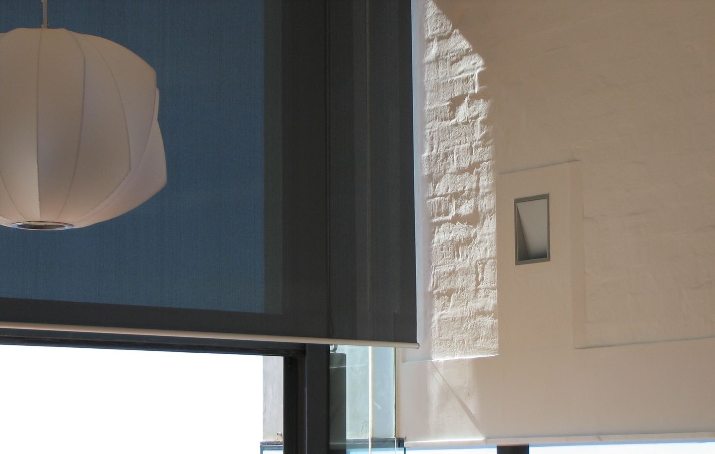 Holman House  Curved white painted brick wall with steel framed window framing the view of the ocean in house in Dover Heights Sydney designed by Durbach Block Jaggers Architects