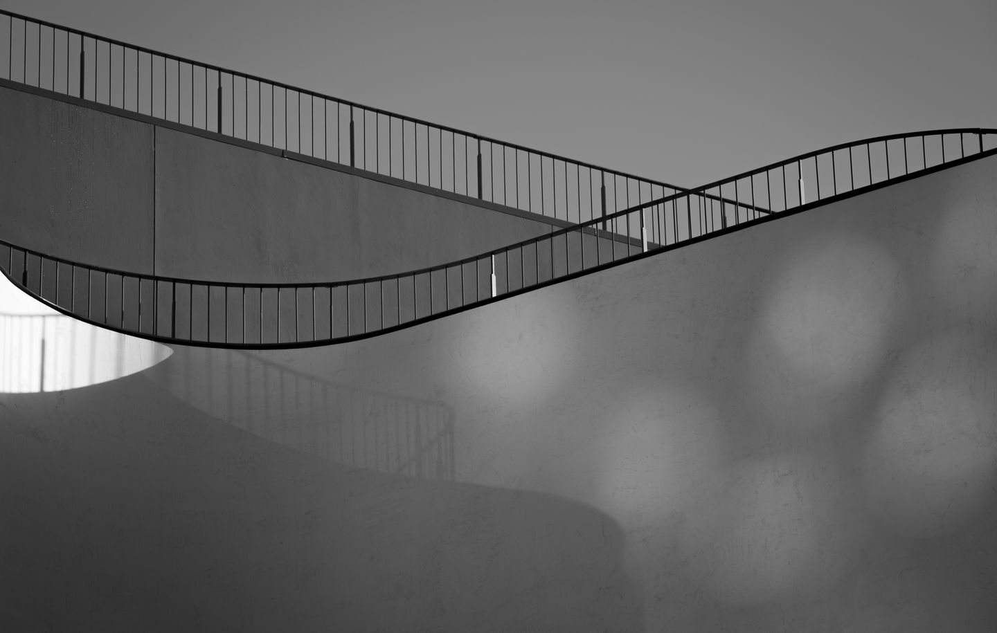 UTS Thomas Street  Closed up view of curved white rendered walls and thin steel balustrade of a university building at UTS Ultimo Sydney designed by Durbach Block Jaggers Architects
