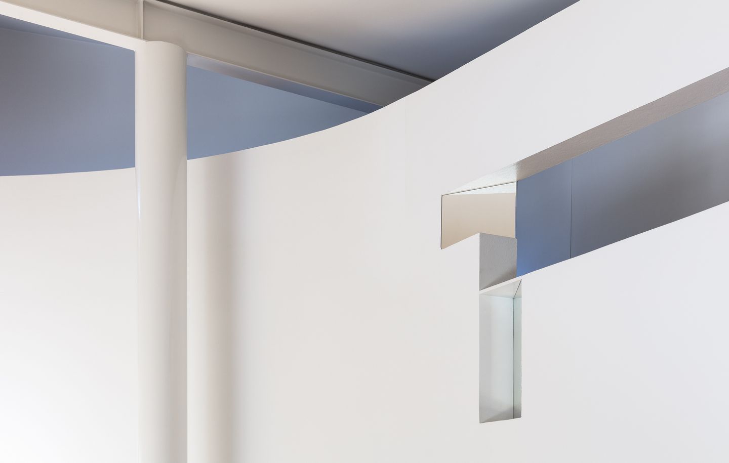 Droga Apartment  Curved plaster wall with exposed steel beams and columns in penthouse apartment above industrial warehouse in Surry Hills Sydney designed by Durbach Block Jaggers Architects