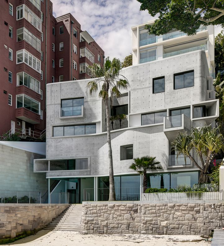 Photography by Brett Boardman  Raw sculptural concrete brutalist house on located on the Sydney harbour front in Point Piper designed by Durbach Block Jaggers Architects.